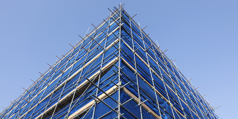 web_blue-scaffolding_credit_anton-havelaar_shutterstock_120477514.png