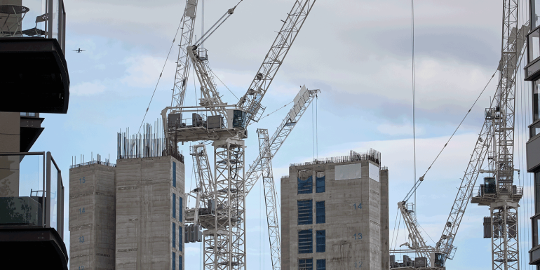 Building construction of apartment blocks, with cranes, at Battersea in south west London-Image credit - Getty - 1270520012