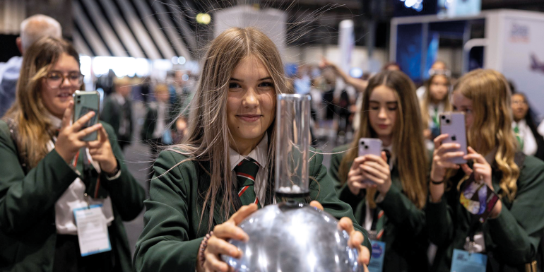 student discovers static energy with van de graaf generator