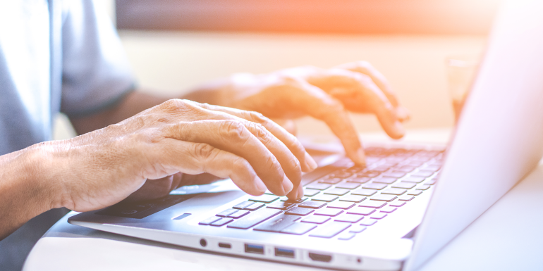 Asian Businessman Working On His Laptop Stock - credit- shutterstock-1080354731