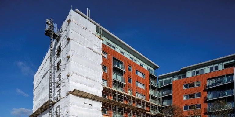 Cladding replacement scaffolding stock photo. CREDIT istock - 1460828091
