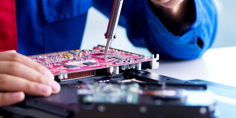 Repairman working in technical support fixing computer laptop. CREDIT-shutterstock-1538540942