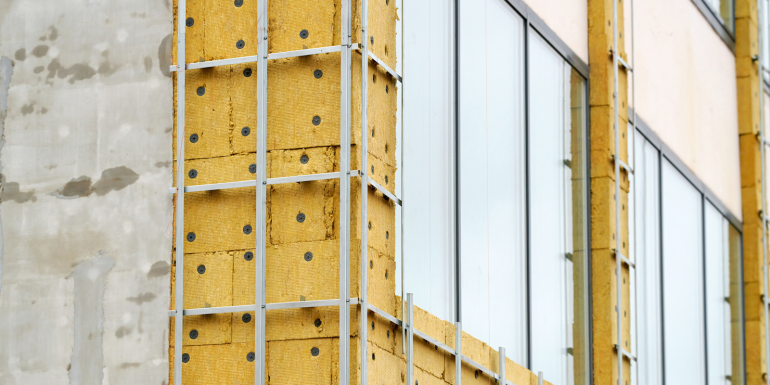 Building renovation, facade wall insulation preparing for cladding.CREDIT-shutterstock-2391581025