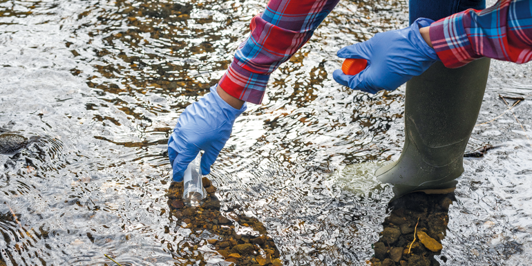 Taking a water sample. CREDIT - Istock-1327060829