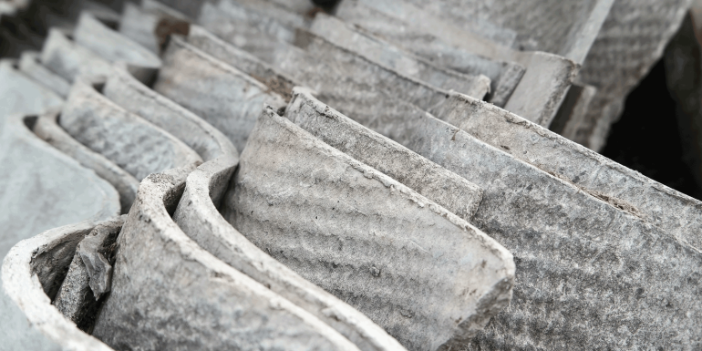 stack of asbestos roofing sheets. credit_adam-sadlak_istock-1490725072