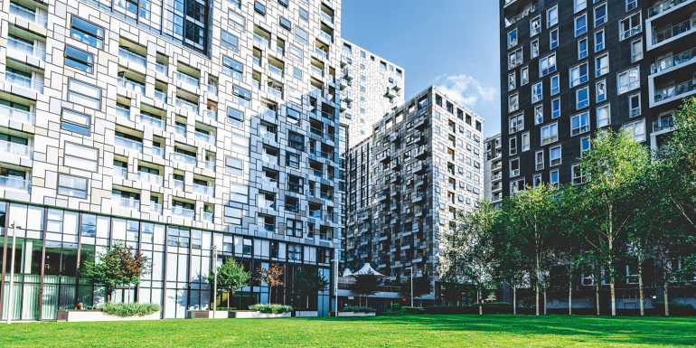 buildings by grass. CREDIT_istock-2181150629