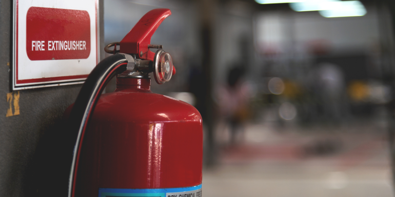 red fire extinguisher. credit_istock-1058291060