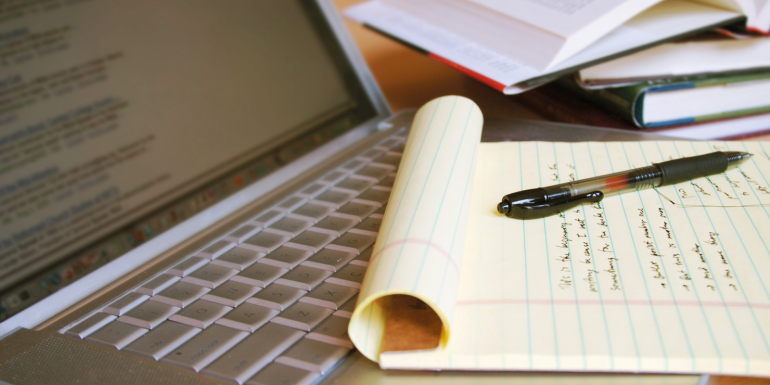 pen paper laptop notetaking. credit_istock-92259124