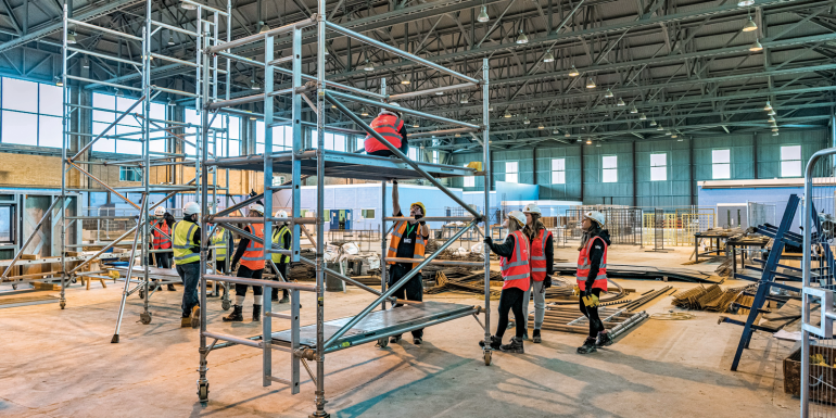 people on scaffolding.CREDIT - Supplied