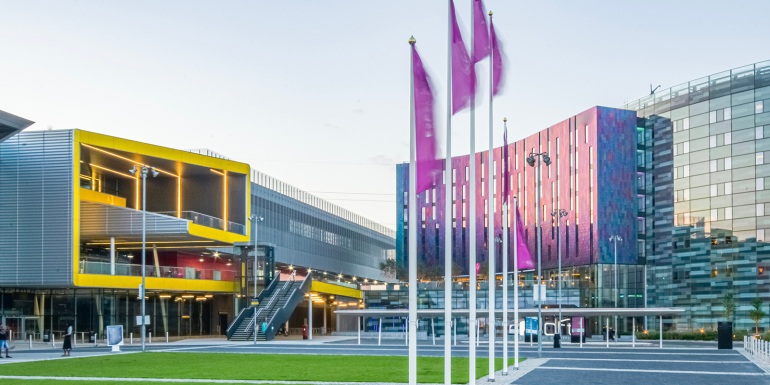 Modern buildings with colorful, futuristic architecture. CREDIT_shutterstock_2539769189