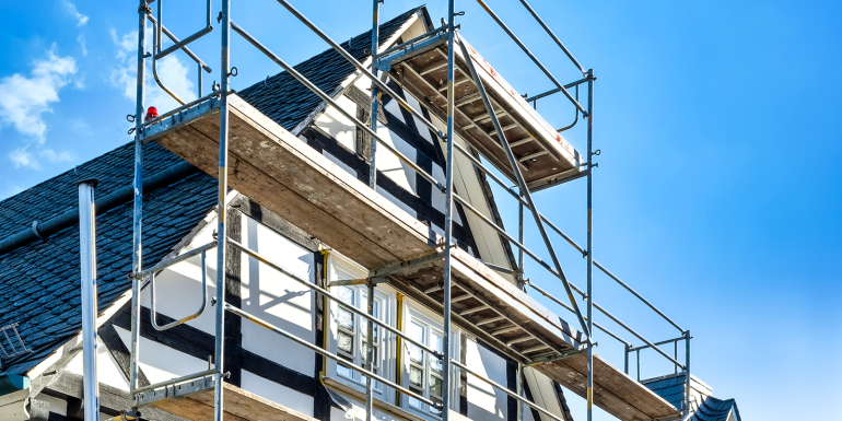house with scaffolding. CREDIT_iStock-1305219914