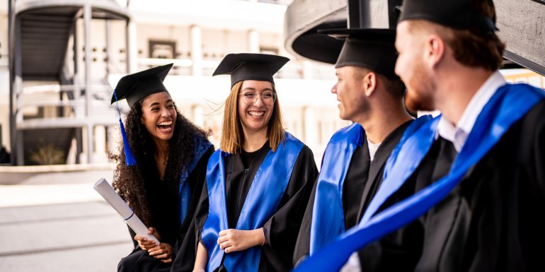 web_young-graduates-friends-talking-on-graduation_credit_fg-trade-latin_istock-1496192007_1600x800.jpg