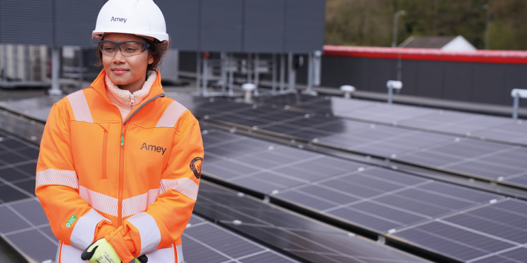Engineer in safety gear near solar panels.CREDIT_Amey