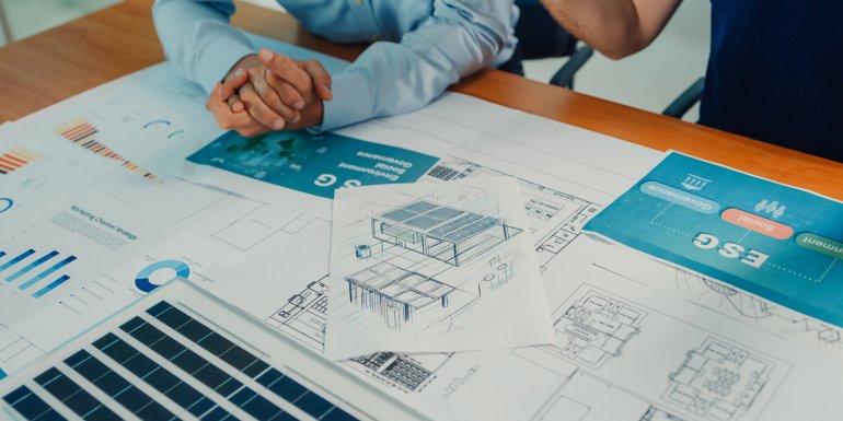 web_closeup-team-of-industrial-engineers-brainstorming-of-sustainability-renewable_credit_mtstock-studio_istock-1944774366_1600x800.jpg