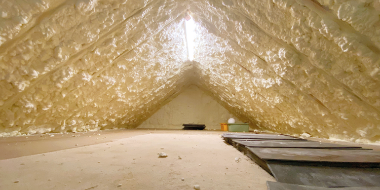 attic pumped with spray foam insulation to reduce heat loss. CREDIT_istock-134636371 
