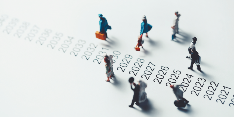 Miniature people walking beside AD.Image credit | shutterstock