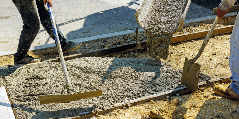 Process of installing construction of new sidewalks laying concrete cement