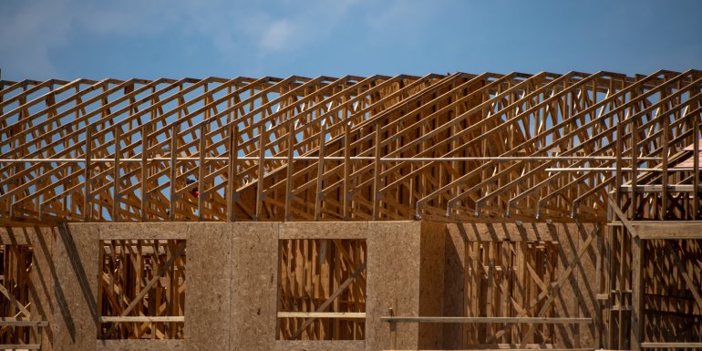 Timber Frame House with OSB Sheathing. Timber Frame House. credit_shutterstock_2499419673