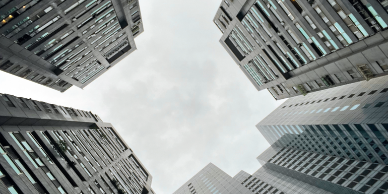 Towering high-rise buildings surrounding with modern and futuristic architecture, creating a dynamic and majestic urban landscape