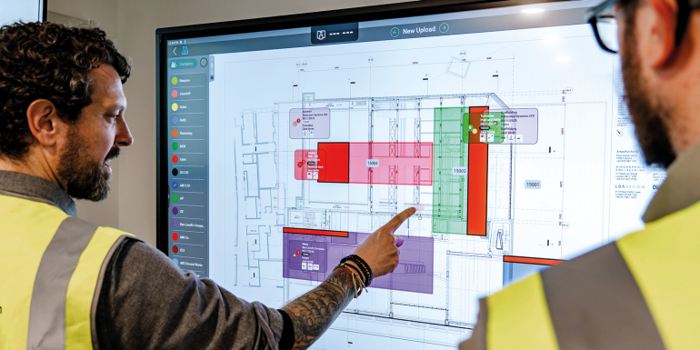 A man using a touchscreen display.credit_datascope
