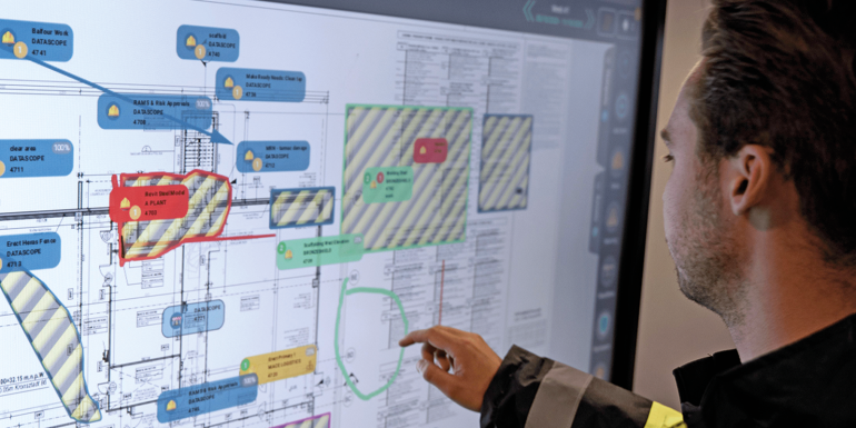 A man using a touchscreen display.CREDIT_DataScope