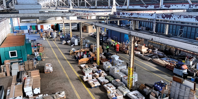 Large industrial warehouse with stored materials.