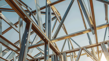 Building Steel Skeleton Frame at Sunset. Modern Building Structure Technologies. Image credit-Alamy-ppagmg
