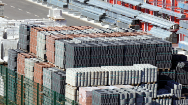 Stacks of construction blocks and metal beams. CREDIT_shutterstock_425215621.png