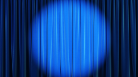 web_blue-curtain-with-spotlight_credit_istock-1223199962.png