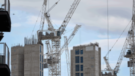 Building construction of apartment blocks, with cranes, at Battersea in south west London-Image credit - Getty - 1270520012