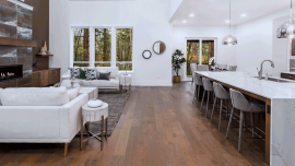 Beautiful living room and kitchen in new large modern luxury home with open concept floor plan. Image credit - Shutterstock - 1950204175