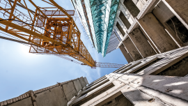 Yellow Crane on the construction of the building. Image credit | iStock