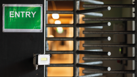 Metal turnstile at a construction site.CREDIT-istock-1317602754