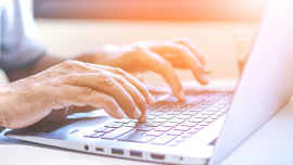 Asian Businessman Working On His Laptop Stock - credit- shutterstock-1080354731