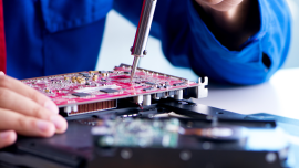 Repairman working in technical support fixing computer laptop. CREDIT-shutterstock-1538540942 