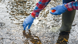 Taking a water sample. CREDIT - Istock-1327060829