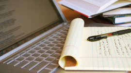 pen paper laptop notetaking. credit_istock-92259124