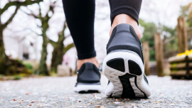 Woman Legs Sport Shoe Walk In Park Outdoo.iStock-961726470