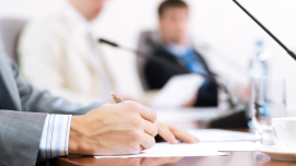 businessman writing on paper notes communicate. CREDIT_shutterstock_121787119