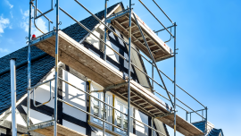house with scaffolding. CREDIT_iStock-1305219914