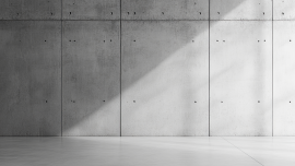 Minimalist concrete wall with soft lighting.CREDIT_shutterstock_2520423781