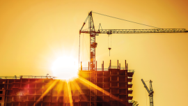 construction site building crane sunset. CREDIT_shutterstock_1368636473