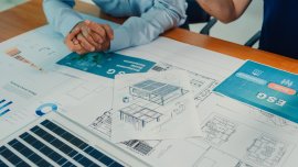 web_closeup-team-of-industrial-engineers-brainstorming-of-sustainability-renewable_credit_mtstock-studio_istock-1944774366_1600x800.jpg