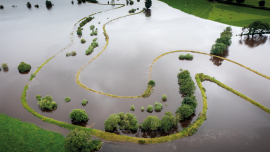 River in Flood Omagh Northern Ireland- Fairy Water.CREDIT_shutterstock_2379871931