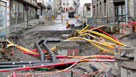 Repair of communications in the city. Pipes and cables.shutterstock_737822464