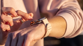 Woman hands in smart watch walking outdoors, step counting, fitness tracker, close up, copy space.Image credit | Shutterstock