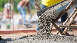 Close up ready mix concrete at construction site.CREDIT_Bannafarsai_shutterstock_2307050647