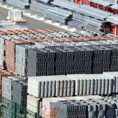 Stacks of construction blocks and metal beams. CREDIT_shutterstock_425215621.png