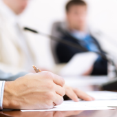 businessman writing on paper notes communicate. CREDIT_shutterstock_121787119