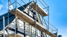house with scaffolding. CREDIT_iStock-1305219914